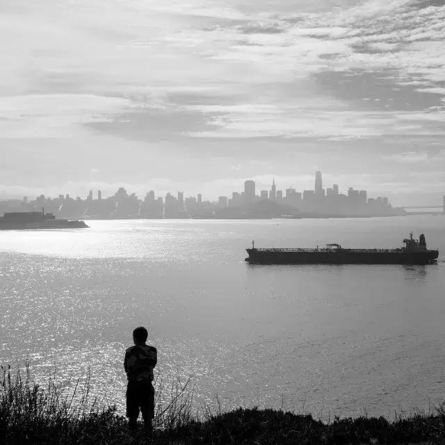 A visitor enjoys the wide views from Angel Island